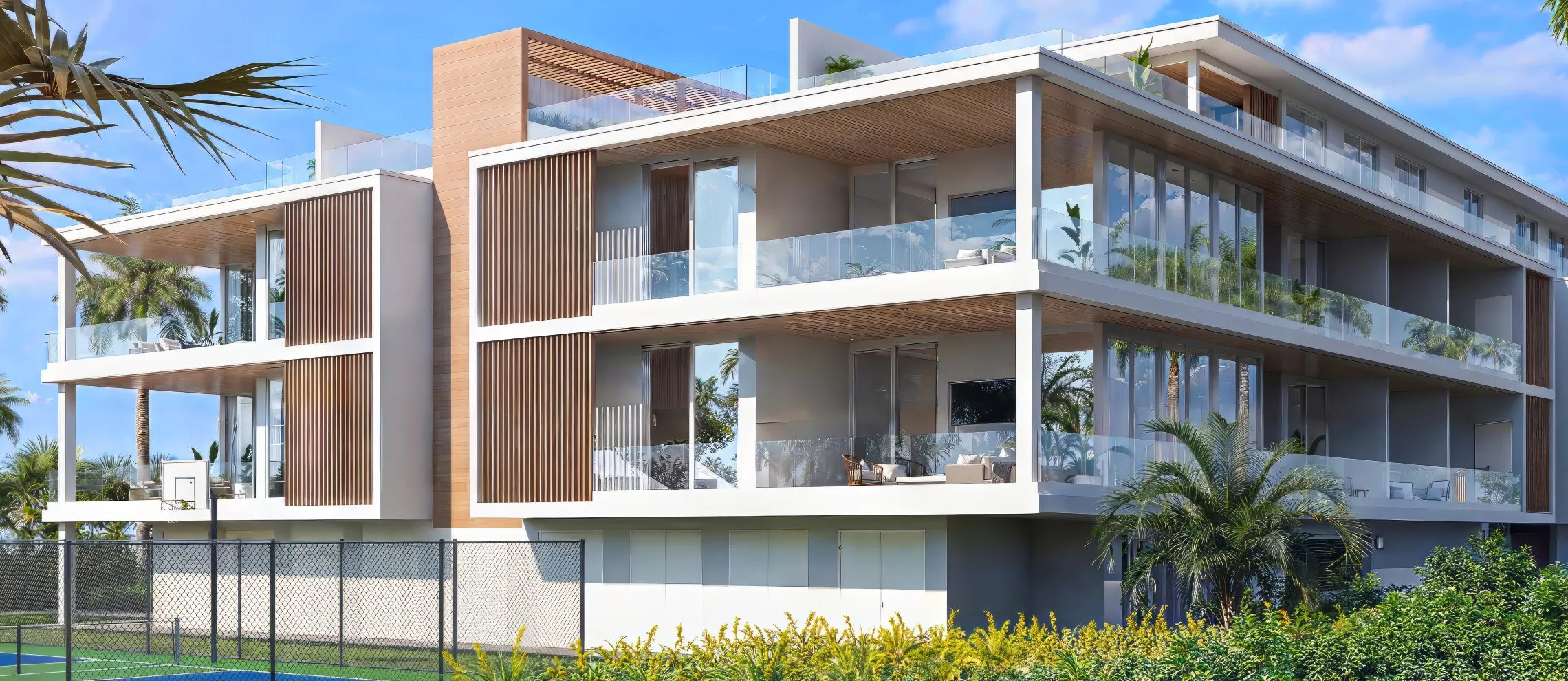 A 3D rendering of a rooftop terrace with a fire pit and a view of the ocean. The terrace is furnished with a comfortable seating area, a dining table, and several potted plants.