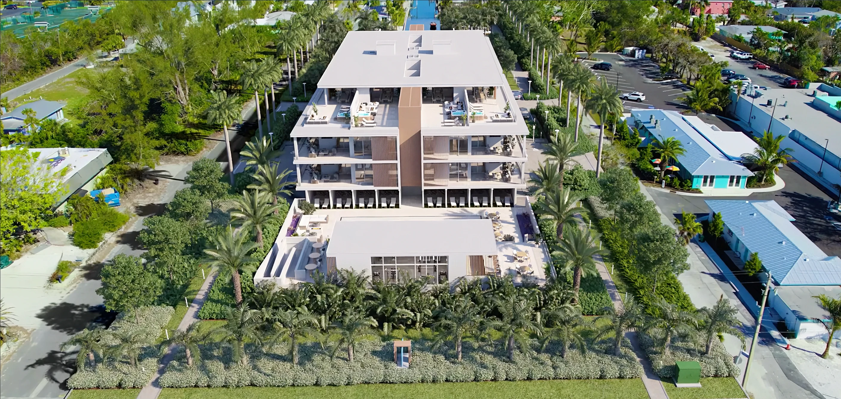 A 3D rendering of a large, modern apartment building with many windows and balconies. The building is surrounded by trees and grass, and there are cars parked in front of it.